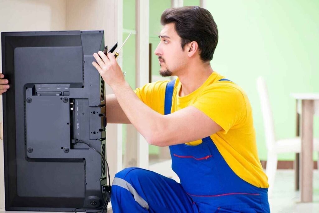 Home service technician fixing a Haier LED television efficiently
